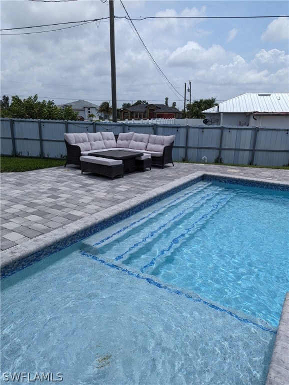 view of swimming pool featuring outdoor lounge area and a patio area