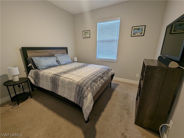 bedroom with light colored carpet