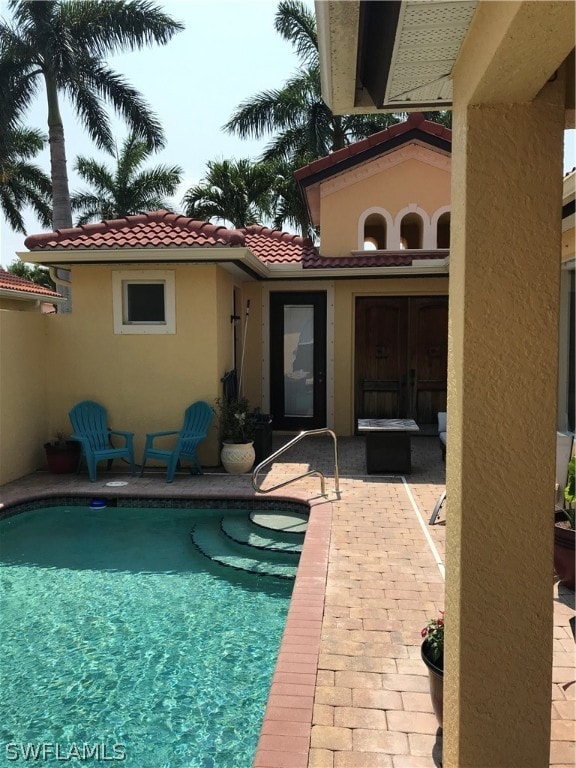 view of swimming pool with a patio area