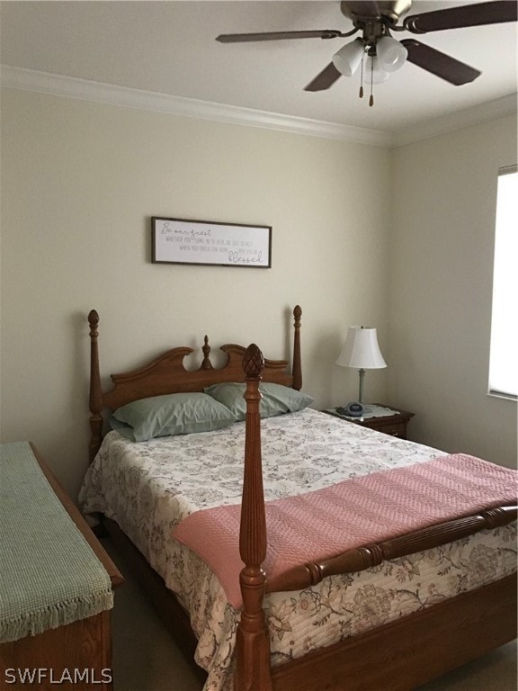 bedroom featuring ceiling fan and crown molding