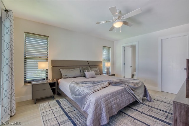 bedroom featuring light hardwood / wood-style flooring and ceiling fan