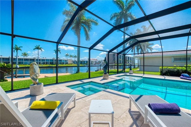 view of swimming pool with a water view, an in ground hot tub, a lanai, and a patio area