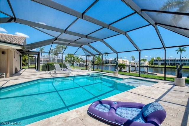 view of swimming pool with a water view, an in ground hot tub, a patio area, and glass enclosure