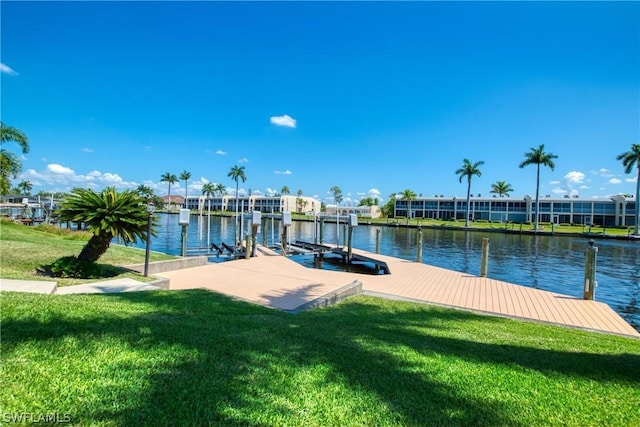 dock area featuring a water view and a yard