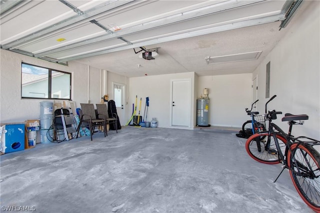 garage with a garage door opener, electric panel, and electric water heater