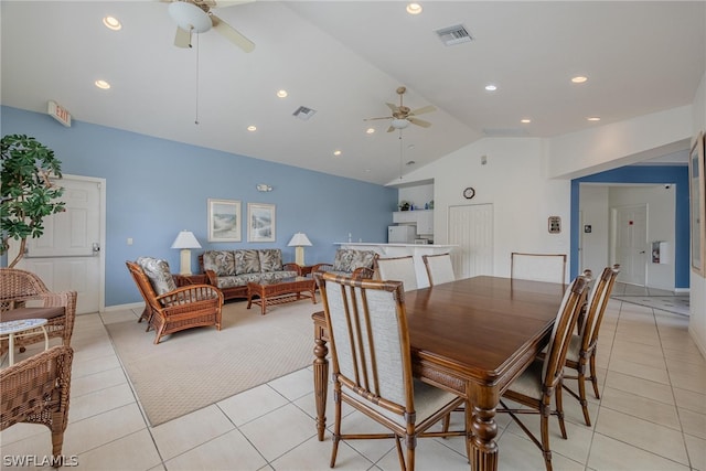 dining area with vaulted ceiling, ceiling fan, and light tile flooring