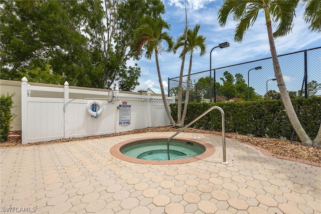 view of pool featuring a community hot tub