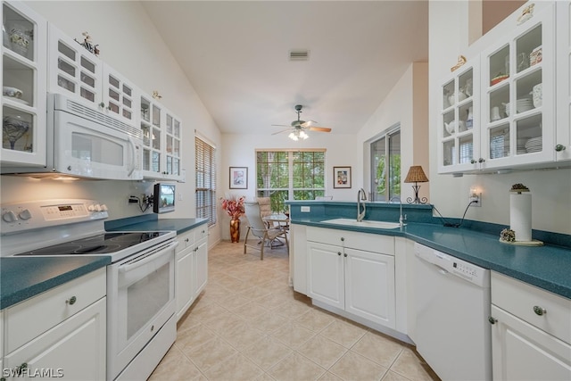 kitchen featuring ceiling fan, white cabinets, sink, white appliances, and lofted ceiling