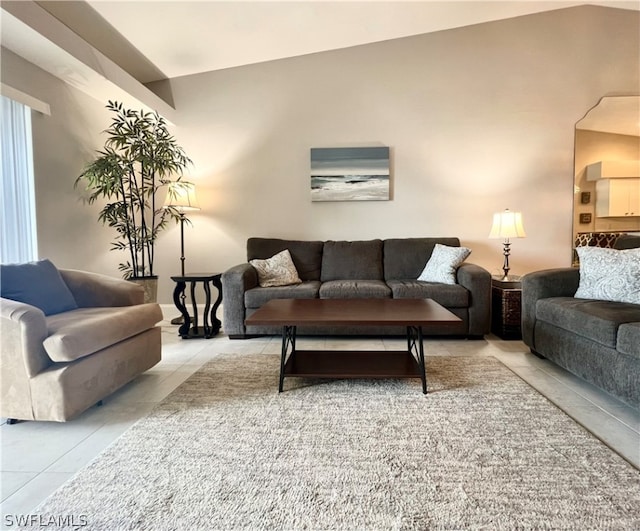 living room with light tile patterned flooring and lofted ceiling