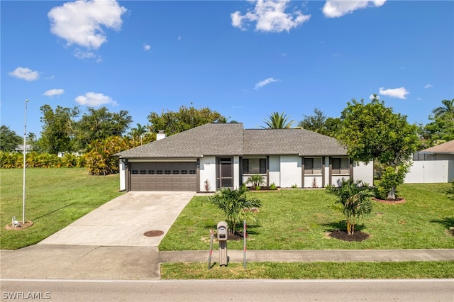 ranch-style house featuring a garage and a front yard