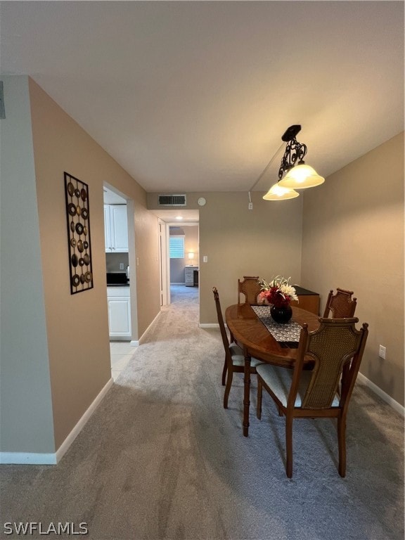 view of carpeted dining space