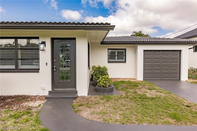 entrance to property featuring a garage