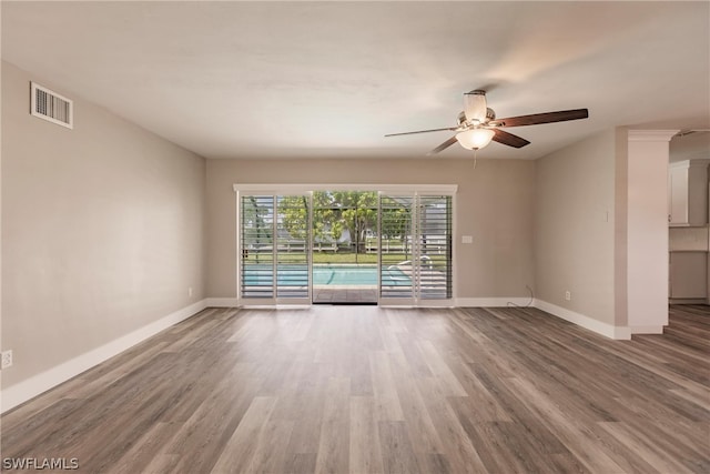 spare room featuring ceiling fan and wood-type flooring