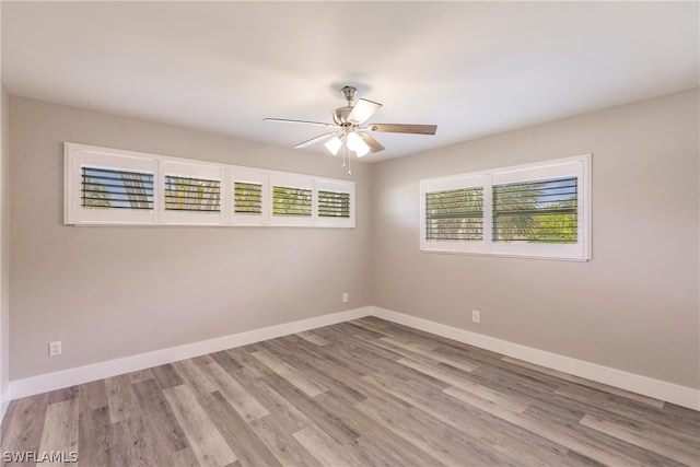 unfurnished room featuring ceiling fan and wood-type flooring