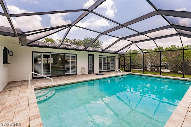 view of pool featuring a lanai and a patio