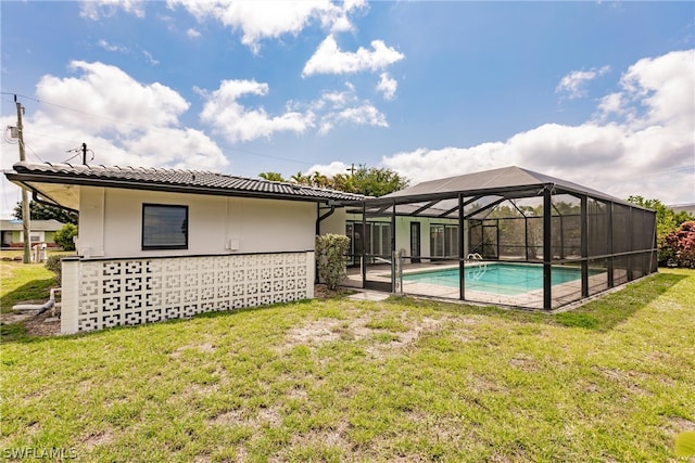 exterior space with a lawn, a lanai, and a patio