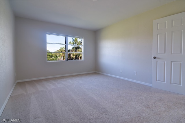 empty room featuring light colored carpet