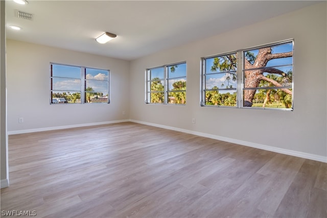 unfurnished room featuring light hardwood / wood-style floors