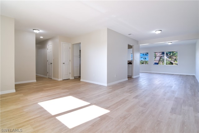 spare room with light hardwood / wood-style flooring