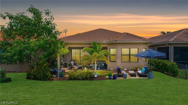 11643 Meadowrun Cir, Fort Myers, FL 33913 - back of house with a lawn, a patio area, an outdoor living space, and stucco siding