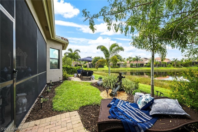 11643 Meadowrun Cir, Fort Myers, FL 33913 - view of grassy yard with a water view and a patio area