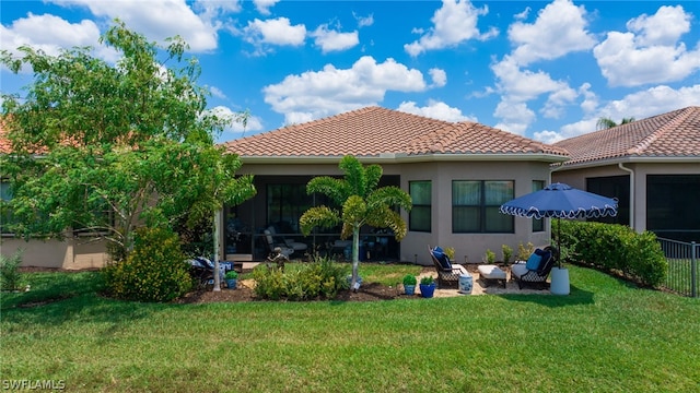 11643 Meadowrun Cir, Fort Myers, FL 33913 - rear view of house with a tiled roof, a lawn, and stucco siding
