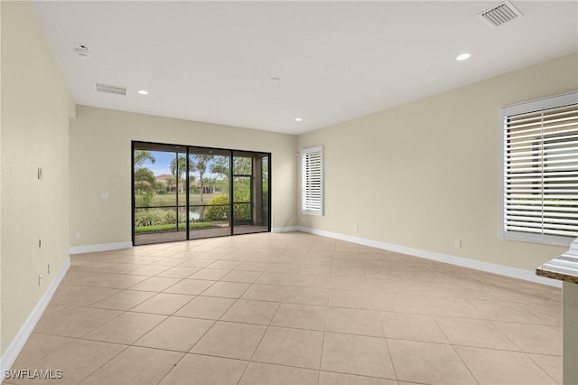 11643 Meadowrun Cir, Fort Myers, FL 33913 - empty room featuring light tile patterned floors, recessed lighting, and baseboards