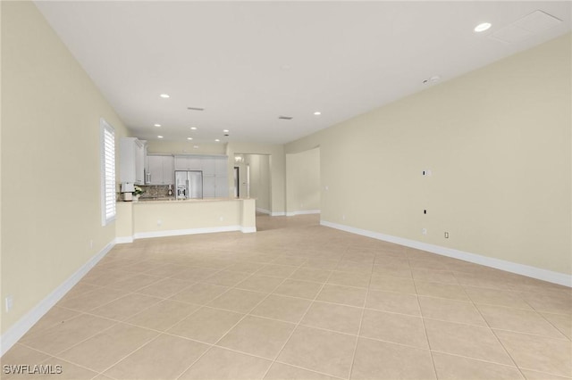 11643 Meadowrun Cir, Fort Myers, FL 33913 - unfurnished living room featuring recessed lighting, light tile patterned floors, and baseboards