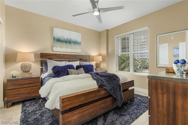 bedroom featuring ceiling fan and light tile floors