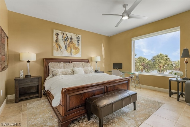 bedroom with light tile flooring and ceiling fan