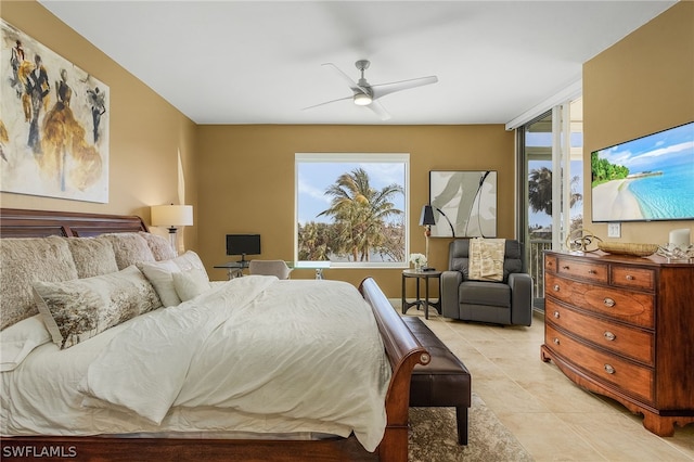 bedroom with light tile flooring, multiple windows, and ceiling fan