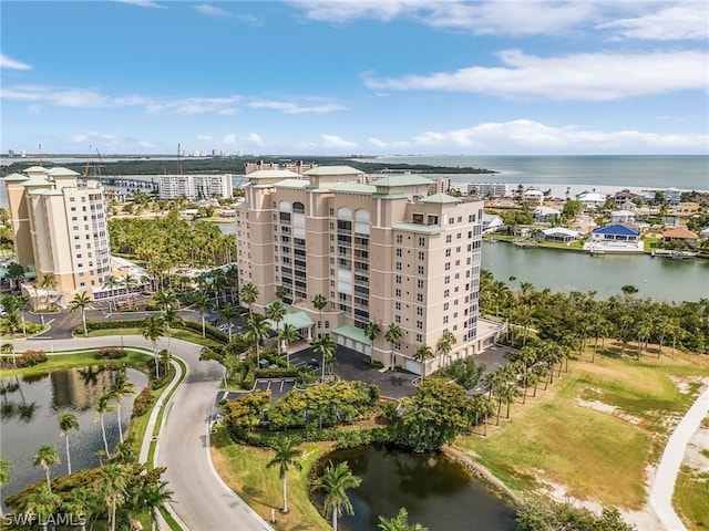 birds eye view of property with a water view