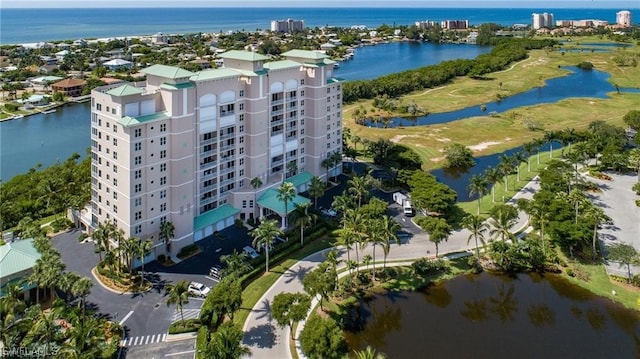 birds eye view of property with a water view