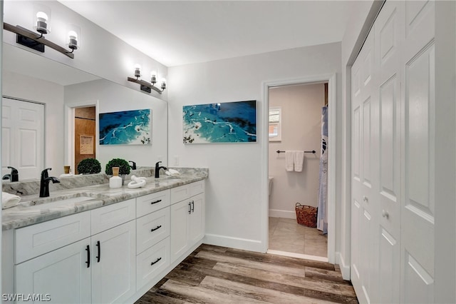 bathroom featuring vanity and wood-type flooring