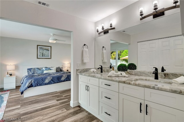 bathroom featuring vanity, ceiling fan, and hardwood / wood-style flooring