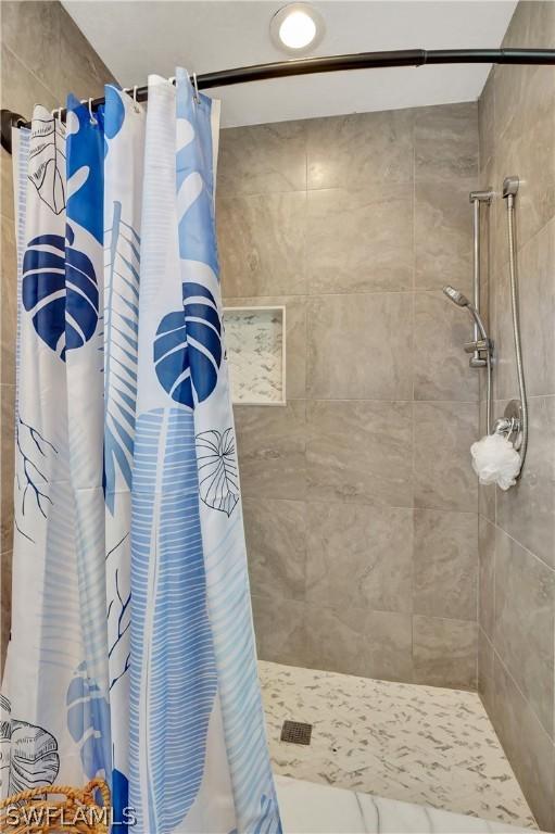 bathroom featuring a shower with curtain