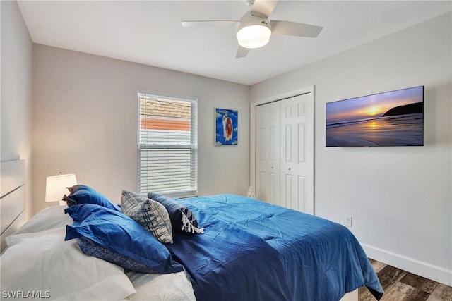 bedroom with ceiling fan, a closet, and wood-type flooring