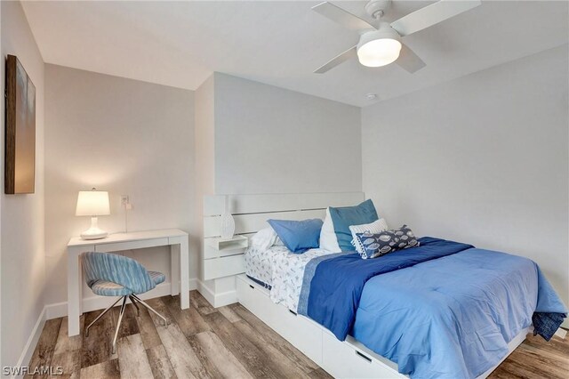 bedroom featuring ceiling fan and wood-type flooring