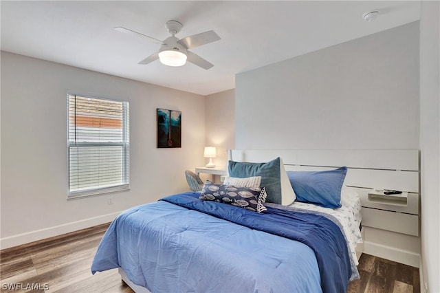 bedroom featuring hardwood / wood-style floors and ceiling fan