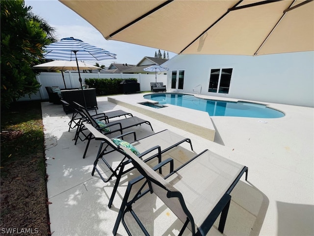 view of swimming pool featuring a patio