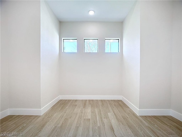 unfurnished room featuring light hardwood / wood-style floors