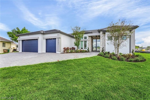 view of front facade featuring a garage and a front lawn