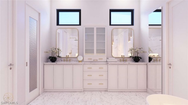 bathroom with tile patterned flooring and vanity