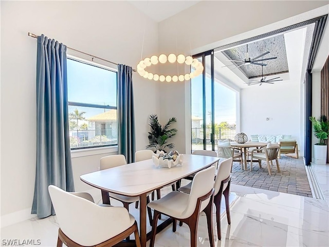 dining space with ceiling fan