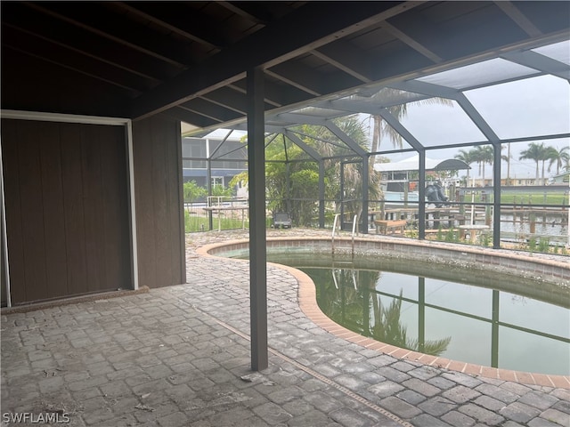 view of pool featuring a water view