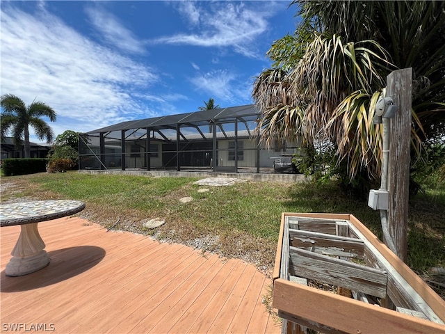 wooden terrace with glass enclosure and a lawn