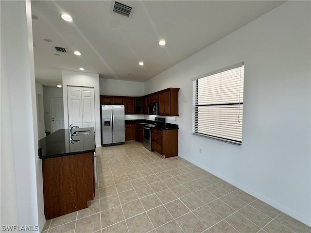 kitchen featuring sink, light tile floors, and appliances with stainless steel finishes