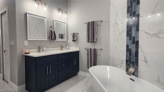 bathroom featuring vanity and a bath