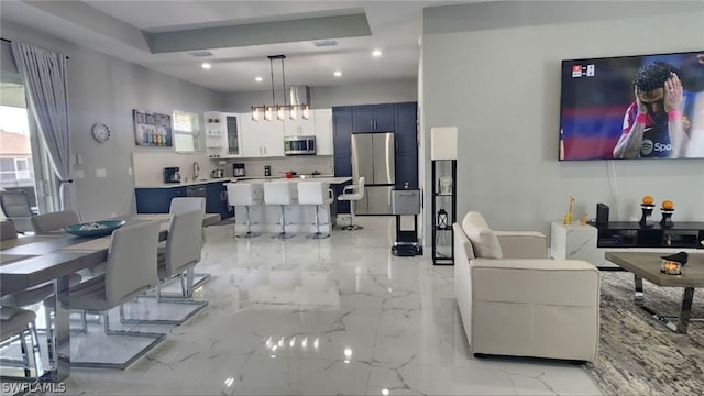 dining space with plenty of natural light and sink