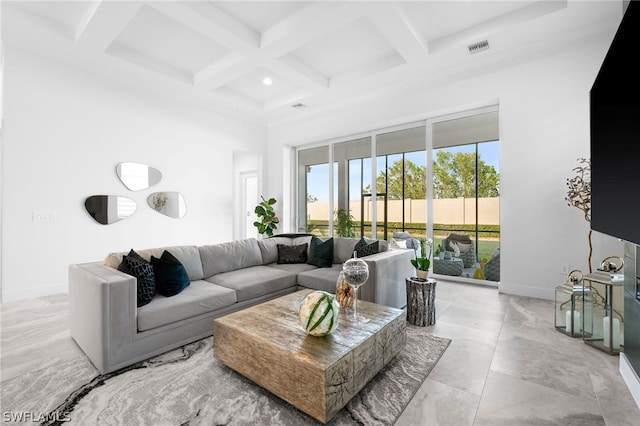 living room with beamed ceiling, coffered ceiling, and a towering ceiling